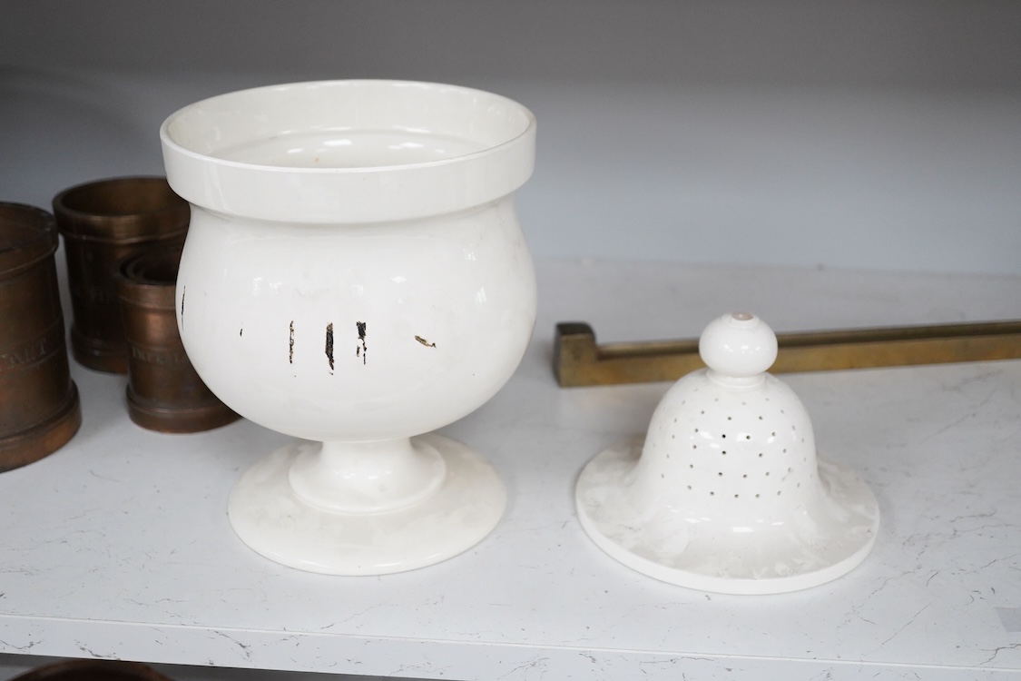 A Victorian pottery pedestal leeches jar and pierced cover, with the remains of the painted word ‘leeches’ around the body of the jar, 30.5cm high